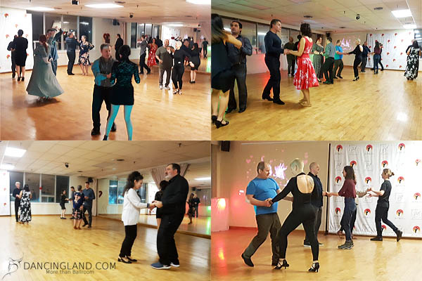 Groups of dancers at a social dance event in February 2022 at Dancingland, moving to the music in a warmly lit dance studio.