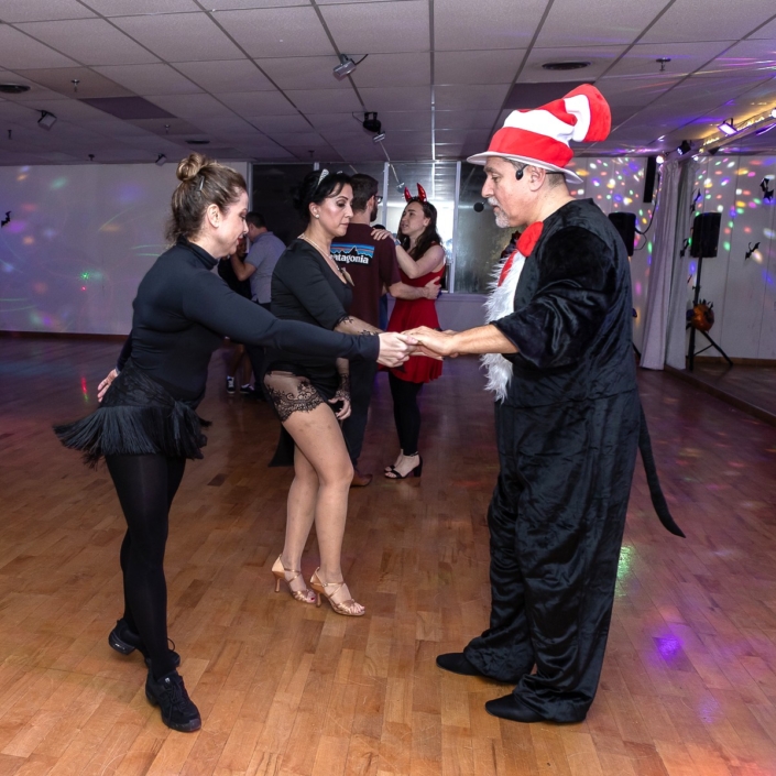 Halloween Dance Social 2025 at Dancingland Dance Studio in North York, Toronto — a night of ballroom and Latin dance, creative costumes, and pure joy. Dancers in vibrant outfits including pirates, gypsies, skeleton ballerinas, and the Cat in the Hat filled the studio with energy, laughter, and movement. The glowing lights, colorful décor, and smiling faces captured the spirit of Dancingland — connection, confidence, and community through dance. Each photo tells the story of rhythm, elegance, and togetherness on the dance floor at Toronto’s most welcoming ballroom and Latin dance studio.